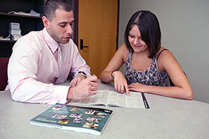 Staff member working with student