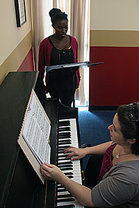 Student receives voice lessons from instructor Amanda Santo