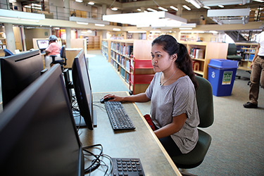 Student Using Computer in Library