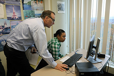 Professor with Student at Computer