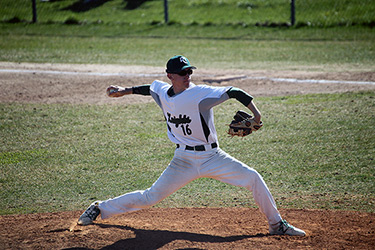 Student Pitching Baseball