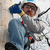 A man climbing a telephone pole