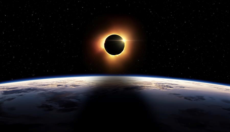 picture of the horizon of Earth from space with the moon eclipsing the sun above the horizon